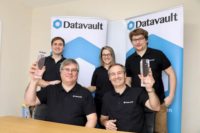 The award-winning Datavault team at the Hayling Island based company’s office. Left to right back: Chris Fisher, Samantha Coles and Alex Higgs. Seated: Neil Strange and Mark Otten (right).