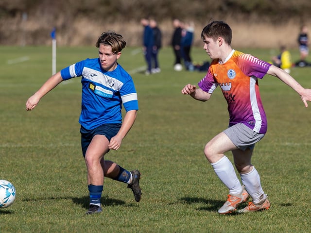 Bulldog (blue) v King George Rovers. Picture: Mike Cooter