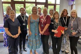 Blossom Health Gosport staff, including Partners Gemma Bond and Ross Brand, with Gosport MP Caroline Dinenage