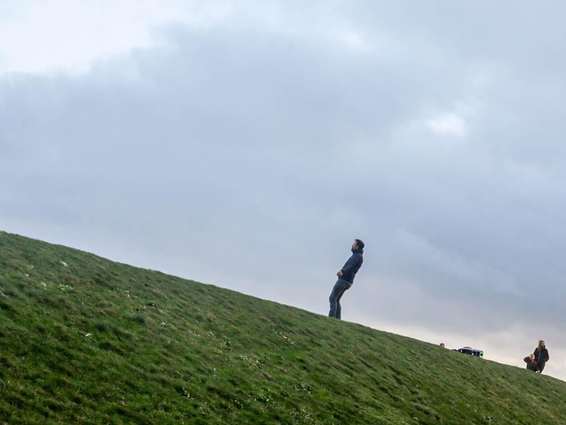 A resident walking against the wind in Southsea.