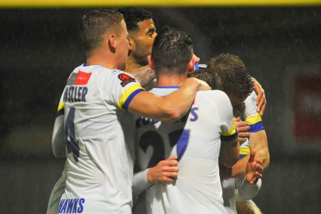 Hawks celebrate Jake McCarthy's stunning goal during tonight's FA Cup win over higher division Torquay. Picture: Martyn White