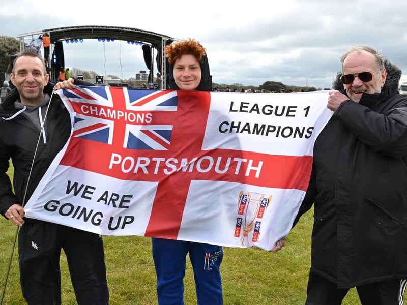 Thousands of Pompey FC fans flocked to Southsea Common to celebrate the team's League One title and promotion. Pictured: Arron, Ress and Raymond NewlanPicture Credit: Keith Woodland