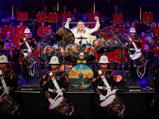 Pictured: Nico McBrain of Iron Maiden plays on stage with the Royal Marines Band Service during the Mountbatten Festival of Music at the Royal Albert Hall on March 7.
