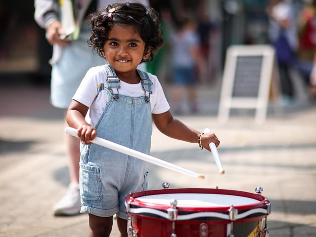 Devagnya, 23 months, tries the drums. Waterlooville Music and Arts Festival took place in the precinct, Waterlooville
Picture: Chris Moorhouse (170824-57)