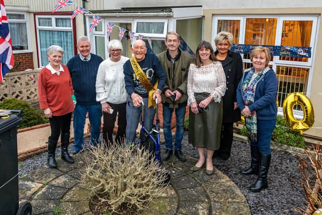 Jack Dixon with his family on his 100th birthday. Daughter Pat Mackenzie (71), nephew Stan Hollis (85), Neice Angie Hatton (77), Jack Dixon (100 - centre), grandson Nathan Mackenzie (49), neice Jackie Lyons (64), great neice Cheryl Tyler (54) and Rosemarie Hollis. Pictured: Picture: Mike Cooter (030222)