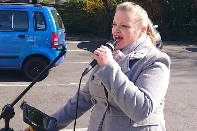 Jennifer Parker-Lummis performs for residents at Hartwell Lodge in Fareham from the social distance of their car park. Picture: Michael Lummis