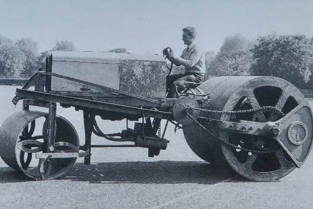 Groundsman Doug Welch on 'Hurcules', the giant roller used at the US Services ground in Portsmouth. Pic: Dave Allen.