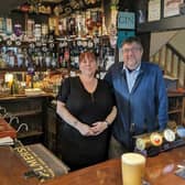 Owner of The Wheatsheaf Mark Brooks and barmaid Colleen Parnell