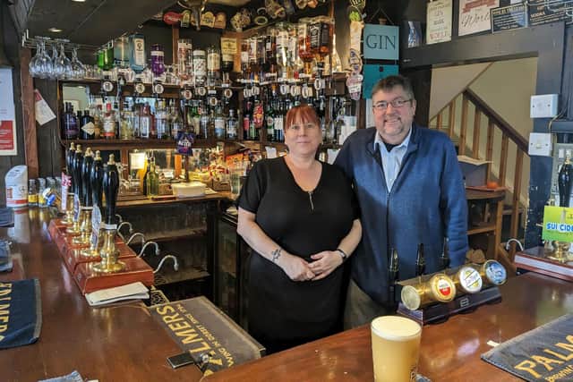 Owner of The Wheatsheaf Mark Brooks and barmaid Colleen Parnell