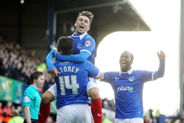 Ricky Holmes celebrates with Miles Storey after Storey nets against Carlisle at Fratton Park in November 2014. Picture: Joe Pepler