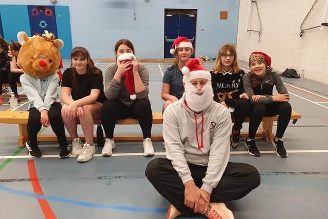 From left - Erin Delahay; Melissa Willett; Ella Mitchell; Florence Hind; Lena Stolarska; Tilly Hutton. Assistant coach Nick Sampson is in Father Christmas gear.