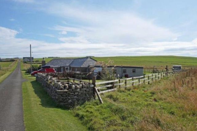 Located in Shapinsay, this bungalow is set on a five acre field, which boasts a large garden and garage. It is fitted with a stylish modern interior, with a Rayburn range kitchen. However it also offers traditional character, from features such as the beamed ceiling in the living room. 155,000 GBP.