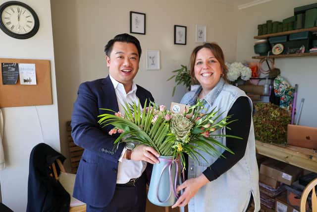 Alan Mak MP with Claire Lester at Claire's Floristry and Tea Room in Bedhampton
