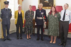 Louise Wilders, second left, and David Nesbit, far right, receive their British Empire Medals from Lord Lieutenant Nigel Atkinson. Picture: Tony Knight Photography