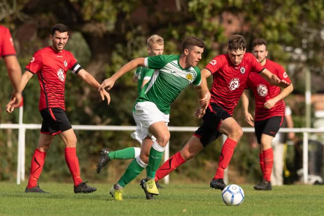 Moneyfields' Brandon Elliott (green) and Locks Heath's Jamie Hall. Picture: Keith Woodland