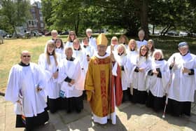The 18 newly-ordained deacons with Bishop Jonathan Frost outside the cathedral