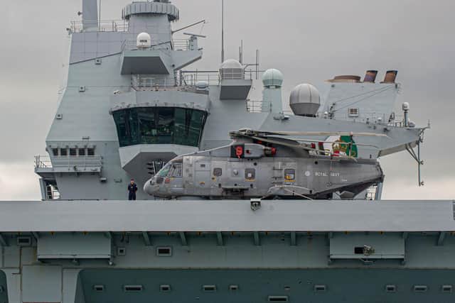 HMS Queen Elizabeth pictured with a Merlin helicopter on her fllight deck,
Picture: Habibur Rahman