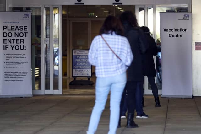 People queue outside a vaccination centre, April 13, 2021. Picture: Steve Parsons/PA Wire