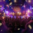 LIVE on stage, featuring the Cast and Musicians.