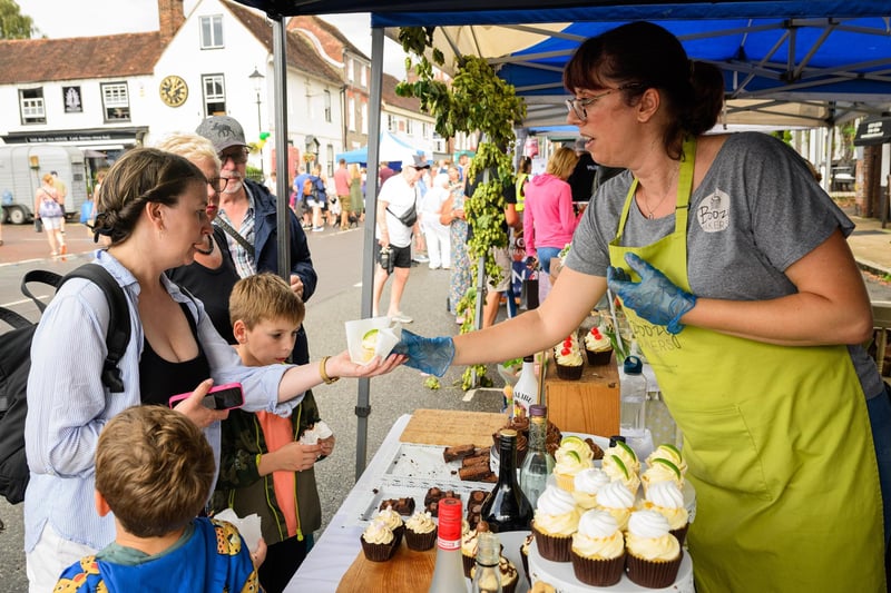 Pictured is: Hayley Stevens gets her G&T muffin from Boozy Bakers at the Taste of Wickham
Picture: Keith Woodland (100921-8)