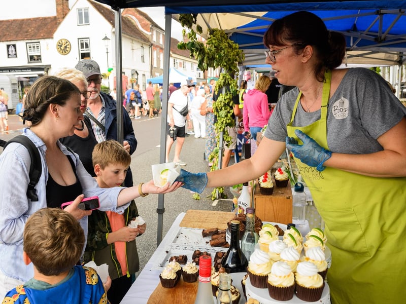 Pictured is: Hayley Stevens gets her G&T muffin from Boozy Bakers at the Taste of Wickham
Picture: Keith Woodland (100921-8)