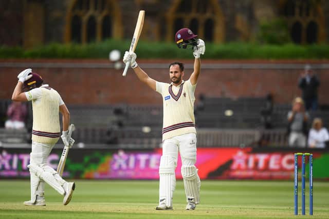 Lewis Gregory celebrates reaching his century. Photo by Harry Trump/Getty Images.