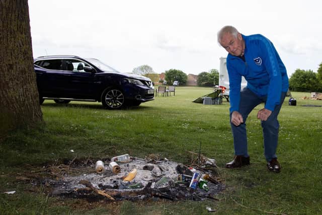 A Traveller community parked on Mengham Park, Hayling Island, and on Thursday afternoon. Police officers and Havant Borough Council were on site on Friday, handing out Section 77 Notices of the Criminal Justice Public Order Act in order to clear the park. Bonfires have been lit on the park land and locals believe the community have destroyed a number of trees recently planted there. Picture: Alex Shute.



Pictured - Richard Coates of Hayling Boxing who was involved in obtaining, planting and maintaining the trees is disappointed to see them vandalised for the second time since their planting.

Photos by Alex Shute