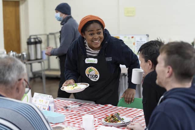 FoodCycle volunteer, Bianca, with people attending the session