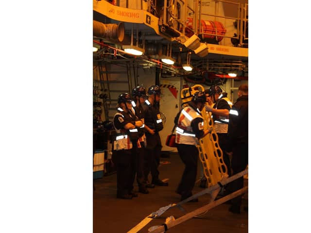 HMS Diamond's sailors get ready to launch the ship's seaboat to help the yacht on Thursday, November 10, 2022