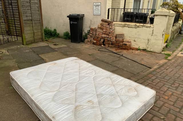 A mattress dumped next to a 'no rubbish' sign in Fawcett Road, Southsea, in Portsmouth
