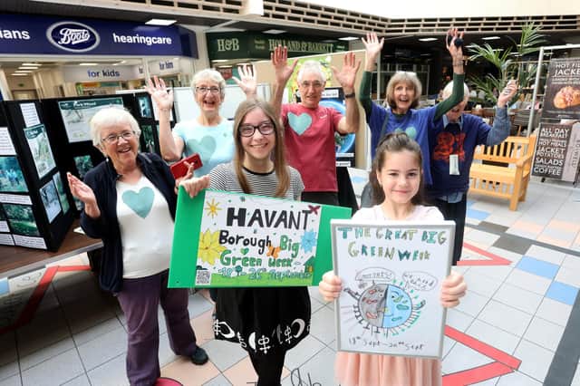 The two young winners of the Havant Big Green Week poster competition are being presented with book tokens by the Havant Climate Alliance,

Pictured are winners Olivia Hill-Burnett, 8, (in pink) and Rebecca Nastri, 13, (in black and white with glasses) along with the good folk from the Havant Climate Alliance behind.

Picture: Sam Stephenson