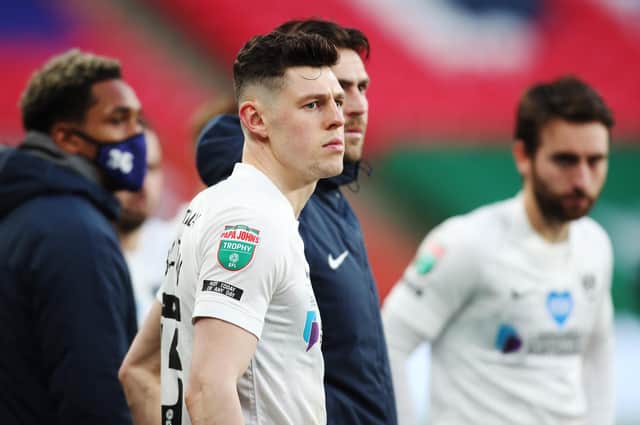 James Bolton looks on as Salford lift the Papa John's Trophy at Wembley