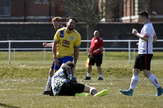 Dale Holmes (yellow) pictured on his Meon Milton debut against Stubbington. Picture: Allan Hutchings
