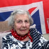 Eunice Forhead, 109, enjoys the King's coronation. Eunice is pictured toasting the King's health with, 'a little drop of Bailey's.' She told the photographer, "a little drop now and again doesn't hurt." Picture: Chris Moorhouse