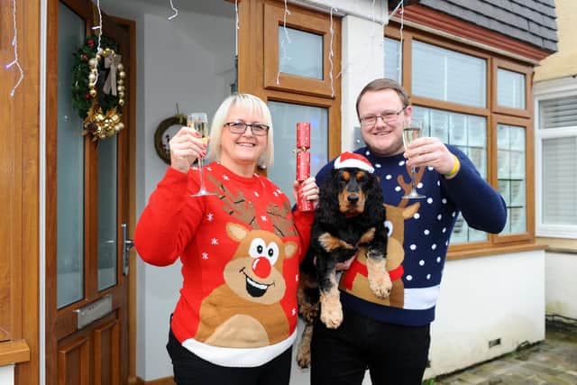 Sally Kingman (55) and her son Jamie Simmons (26) with their dog Max (1).
Picture: Sarah Standing (221220-544)