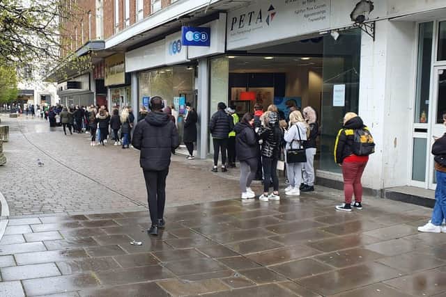Long queue of shoppers queuing for Primark in Portsmouth
