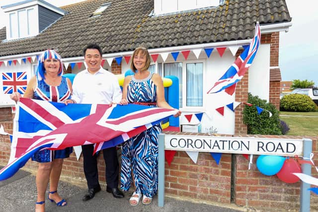 Pictured - Havant MP Alan Mack arrived to celebrate with residents of Coronation Road, pictured here with organisers Irene Wilson and Jo Young.
Photos by Alex Shute