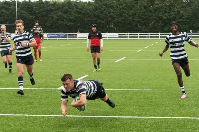 A Havant player goes over for a try against Bouremouth. Picture: Keith Woodland (070821-490)