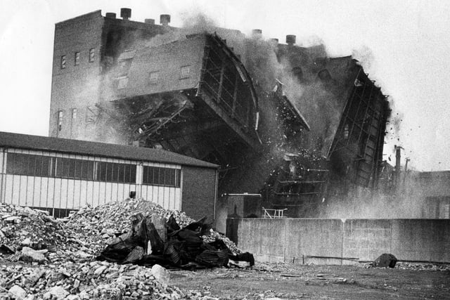 After the power station chimneys had been brought down brick by brick the main structure was brought down by explosives 1983. Portsmouth Power Station in Gunwharf Road in July 1983. PP467 The News, Portsmouth Archive.