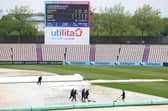Groundstaff sweep water off the cover as rain delays play during day four of the LV= Insurance County Championship match between Hampshire and Lancashire at The Ageas Bowl. Photo by Michael Steele/Getty Images.
