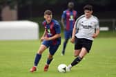 Brodie Spencer (left) on the ball for US Portsmouth during their Wessex League win against Portland last month. Picture: Neil Marshall.