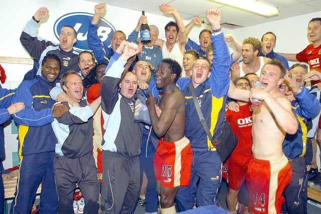 Matt Taylor (far right) and his Pompey team-mates celebrate completing the Great Escape at Wigan. Picture: Steve Reid