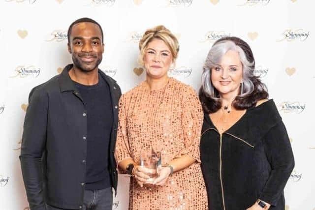 Gabrielle with TV presenter Ore Oduba and Slimming World founder Margaret Miles Bramwell collecting her award.