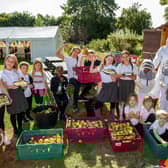 Students from Wicor Primary School at their food festival last year. 
Pictured: Pupils from year 1 to year 6 getting into all sorts of activities from apple pressing to bee keeping last year