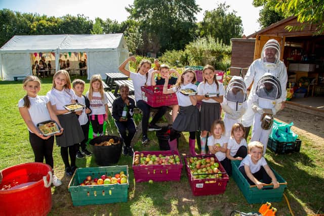 Students from Wicor Primary School at their food festival last year. 
Pictured: Pupils from year 1 to year 6 getting into all sorts of activities from apple pressing to bee keeping last year
