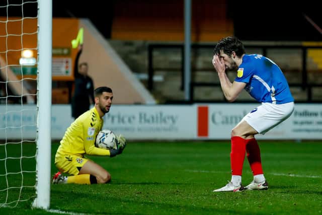 John Marquis can't believe it as a late Pompey chance goes begging against Cambridge United - although the striker was flagged offside. Picture: Simon Davies/ProSportsImages