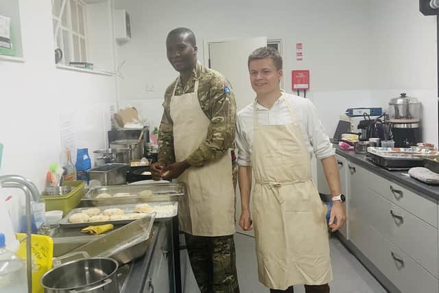 Louis Coward (right) with an army volunteer getting ready for Fishcake Friday