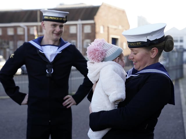 AB Lucy Phillips (right) and her fiance AB Luke Gorst meet family after the Royal Navy aircraft carrier HMS Prince of Wales returns to Portsmouth Naval Base following it's three-month deployment to the Eastern Seaboard of the United States, where the Prince of Wales has been undergoing trials and operating with aircraft and drones.