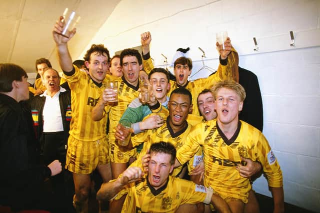 Sutton United players celebrate after the non-league team beat First Division Coventry City in the third round of the FA Cup in January 1989. Photo by Simon Bruty/Allsport/Getty Images.