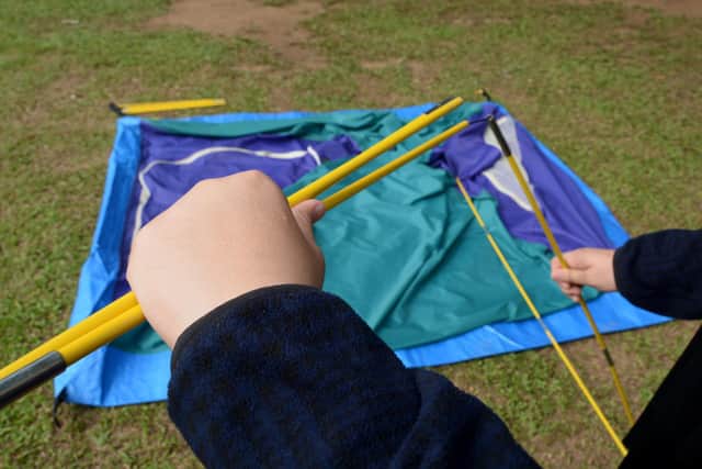 Blaise's approach to putting up a tent...